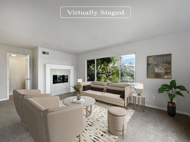 carpeted living room with a fireplace