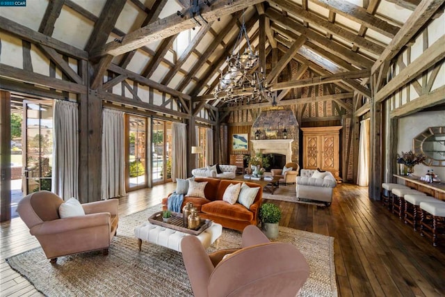 sunroom / solarium with an inviting chandelier and lofted ceiling with beams