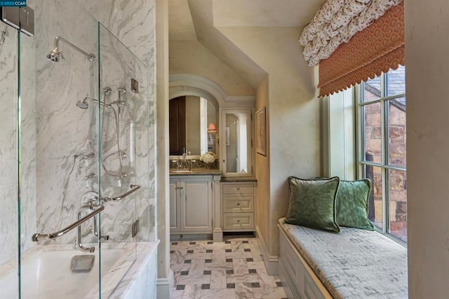 bathroom with vanity, lofted ceiling, tile floors, and walk in shower