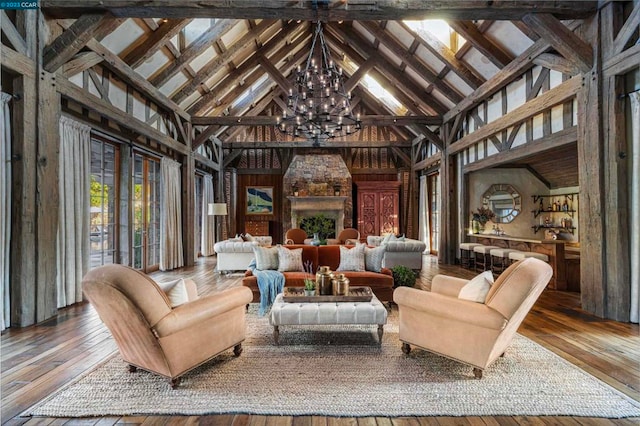 interior space with high vaulted ceiling, dark hardwood / wood-style floors, and a notable chandelier