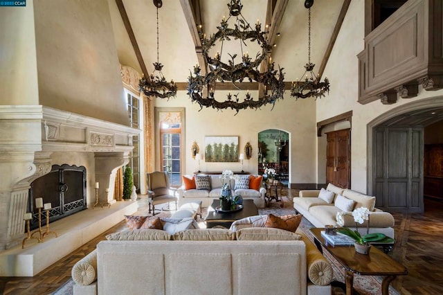 living room with dark parquet flooring, high vaulted ceiling, and beamed ceiling