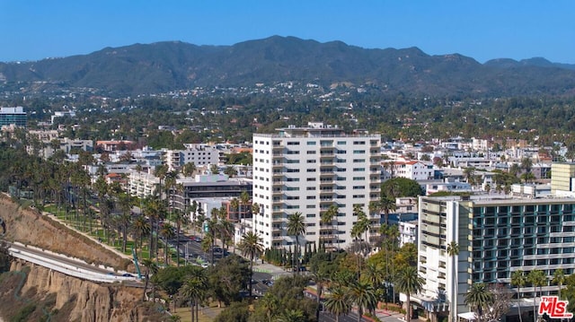 property's view of city featuring a mountain view