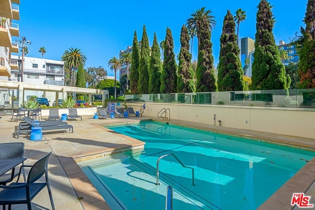 view of pool featuring a patio area