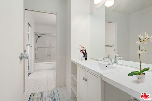 bathroom featuring bathing tub / shower combination, tile floors, and vanity