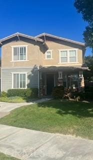 view of front of house featuring a front lawn