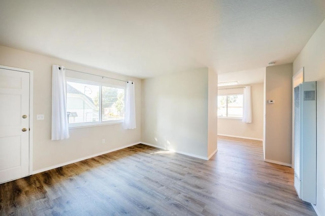 empty room with light hardwood / wood-style flooring