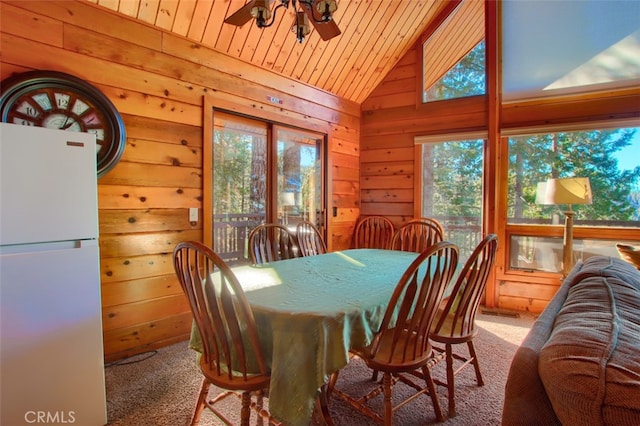 dining area with plenty of natural light, lofted ceiling, and wooden ceiling