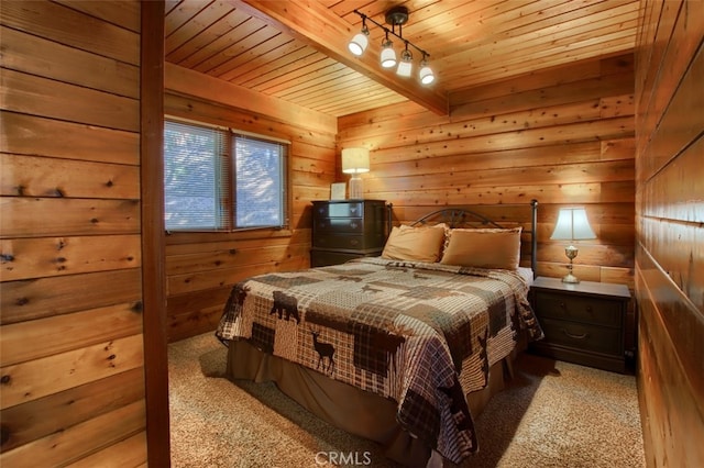 carpeted bedroom featuring beamed ceiling, wood walls, and wood ceiling