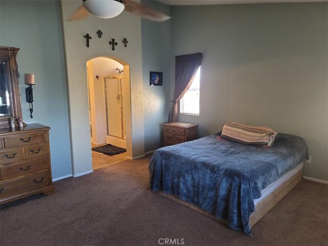 carpeted bedroom with ceiling fan and ensuite bathroom