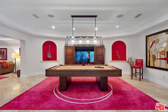 recreation room featuring a tray ceiling, crown molding, and pool table