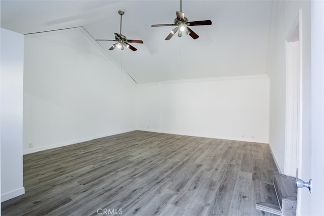 interior space with ceiling fan, hardwood / wood-style floors, and vaulted ceiling