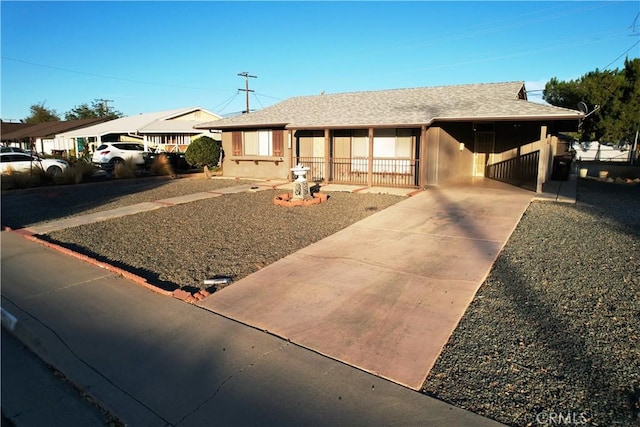 single story home featuring a carport