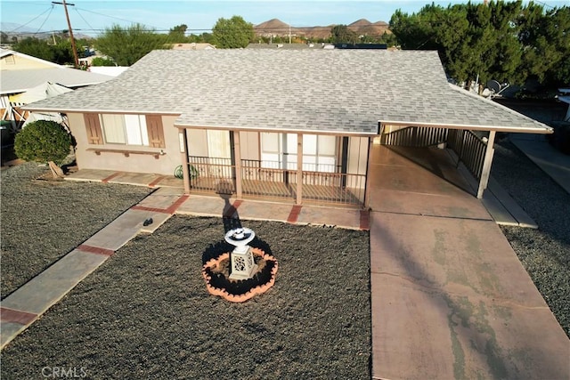 view of front of home with a carport