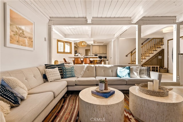 living room with beam ceiling and wooden ceiling