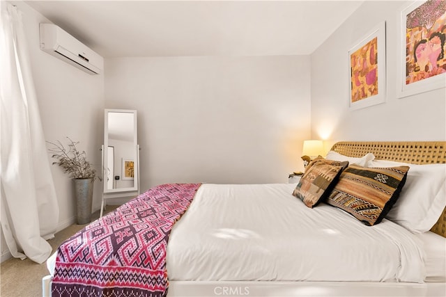 bedroom with carpet floors and a wall mounted air conditioner