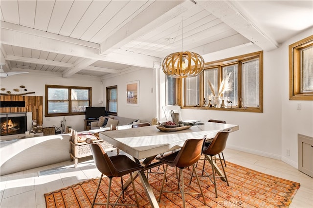 tiled dining room featuring beam ceiling and a chandelier