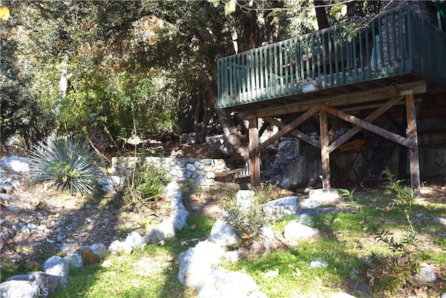 view of yard with a wooden deck