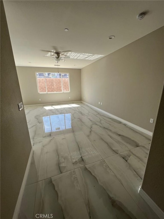 empty room featuring ceiling fan