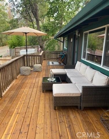 wooden deck with an outdoor hangout area