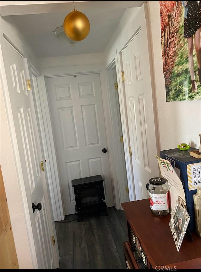 corridor with dark hardwood / wood-style floors