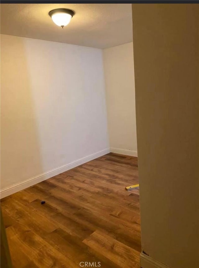 spare room featuring hardwood / wood-style floors