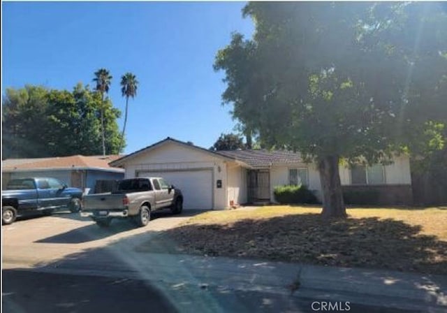 single story home with a garage