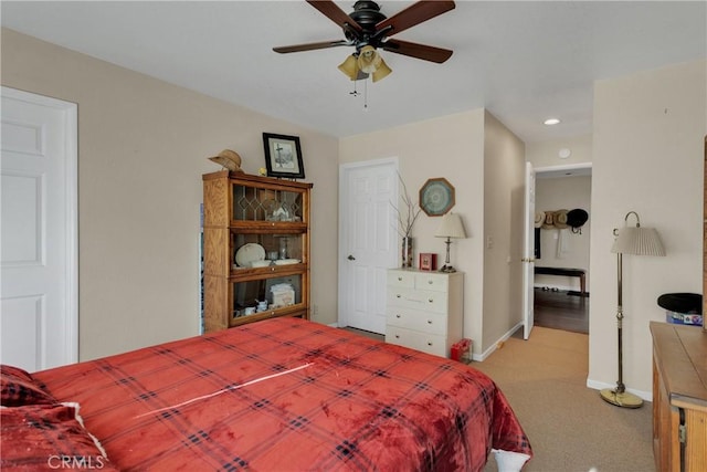 carpeted bedroom with ceiling fan