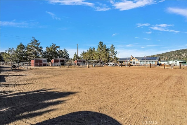 view of yard with a rural view