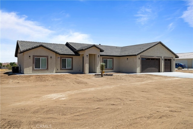 single story home featuring a garage