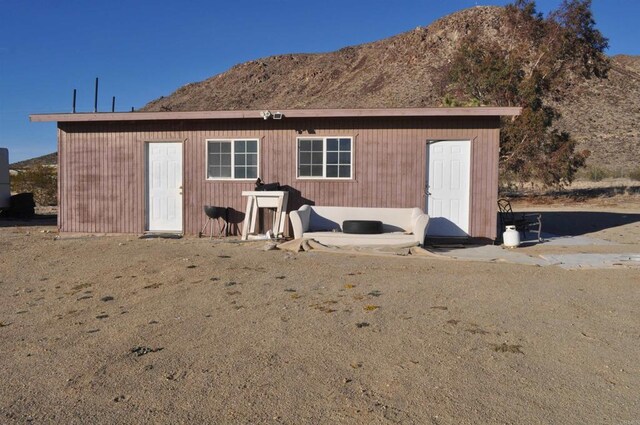 59175 Rocky Acres Rd, Landers, CA 92285 - back of house featuring a mountain view
