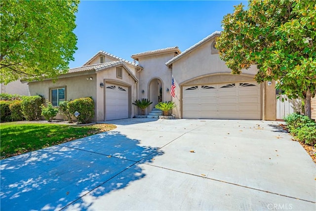 view of front of home with a front yard and a garage