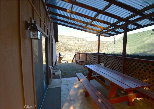 view of patio / terrace featuring a mountain view