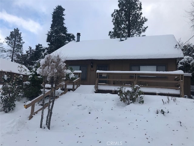 view of snow covered house