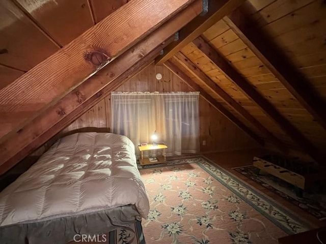 unfurnished bedroom featuring vaulted ceiling with beams, wooden ceiling, and wood walls