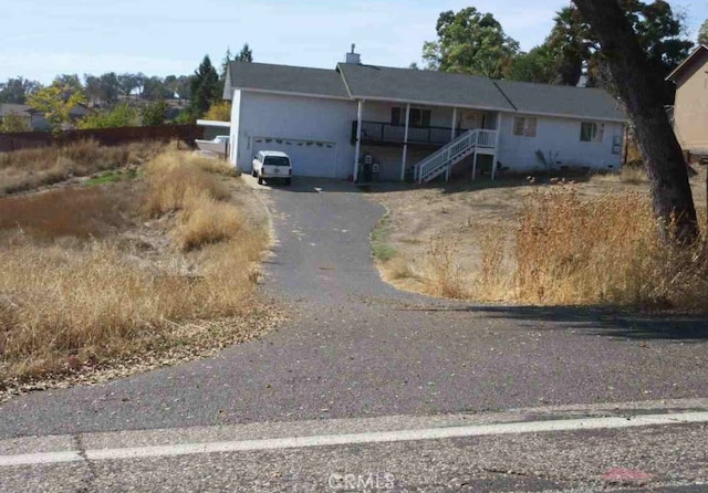 single story home with a garage