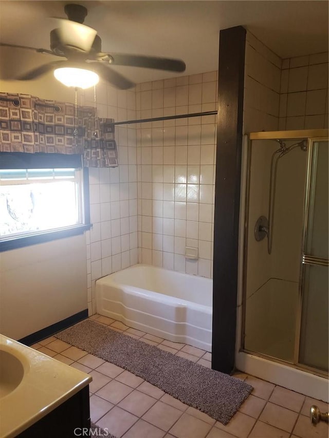 bathroom featuring ceiling fan, tile patterned floors, vanity, and plus walk in shower