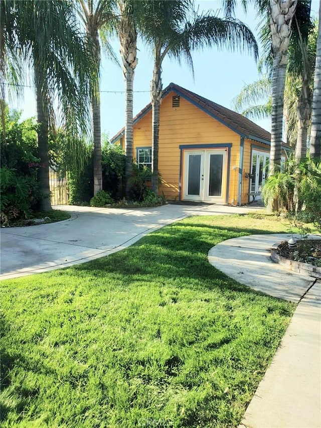 view of yard featuring french doors