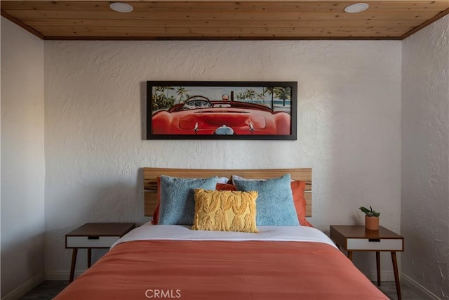 bedroom featuring ornamental molding and wooden ceiling