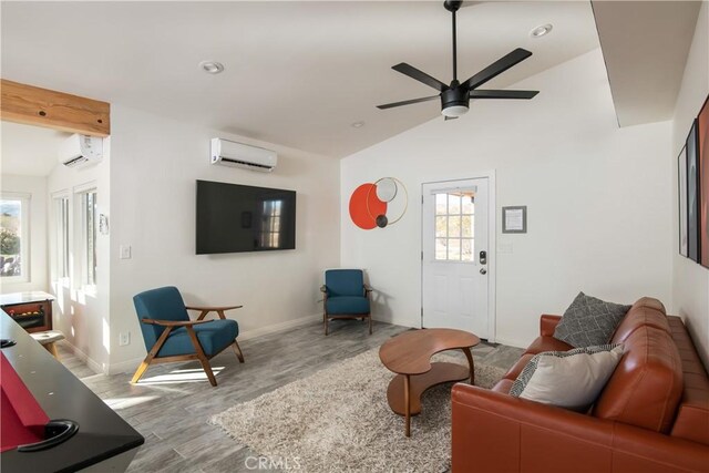 living room with light wood-type flooring, vaulted ceiling with beams, a wall mounted AC, and ceiling fan