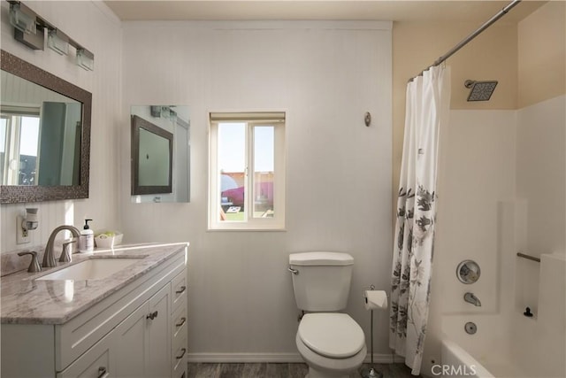 full bathroom featuring toilet, a healthy amount of sunlight, vanity, and shower / bath combo with shower curtain