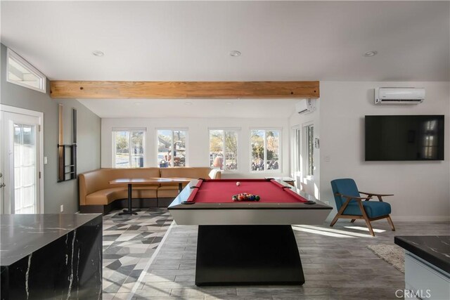 playroom with hardwood / wood-style flooring, billiards, beam ceiling, and a wall mounted AC