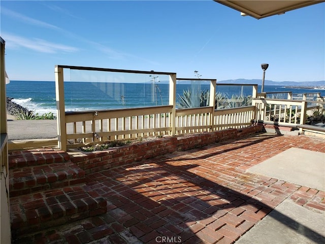 view of patio / terrace featuring a water view