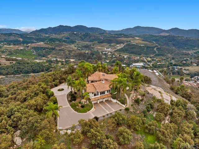 drone / aerial view featuring a mountain view