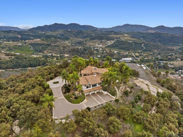 birds eye view of property featuring a mountain view