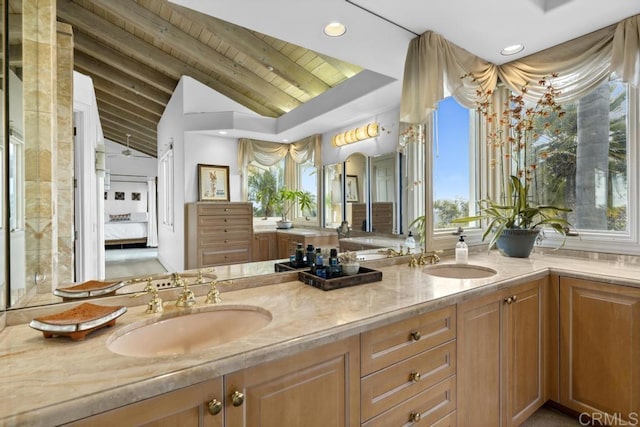 bathroom with wooden ceiling, a sink, vaulted ceiling with beams, and recessed lighting