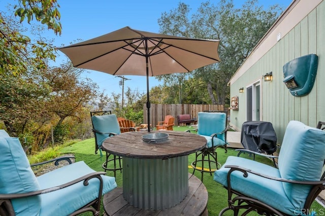 wooden deck featuring grilling area and a yard