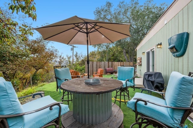 view of patio / terrace featuring fence and an outdoor hangout area