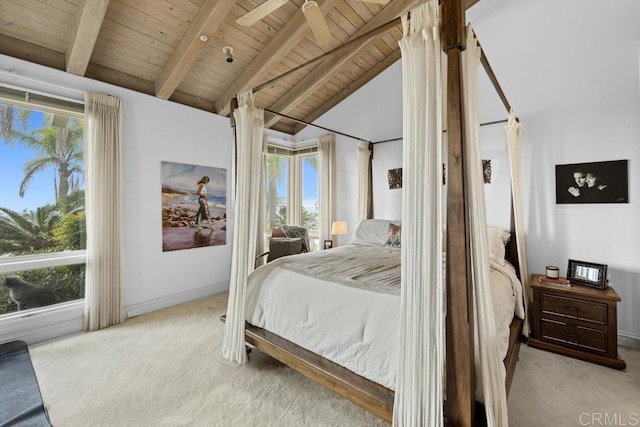 carpeted bedroom with baseboards, wooden ceiling, and lofted ceiling with beams