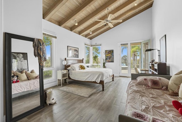 bedroom with wooden ceiling, beamed ceiling, wood finished floors, access to exterior, and high vaulted ceiling