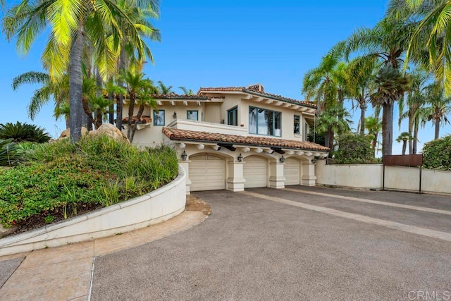 mediterranean / spanish-style house featuring a garage